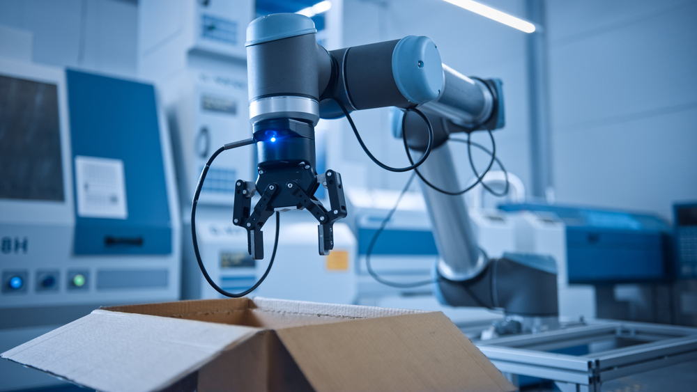 industry,4.0,modern,factory:,programmed,robot,arm,packing,metal,components