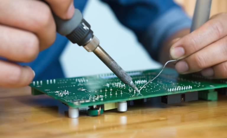 close up image of an electrical engineer working on a pcb board for machine vision lighting