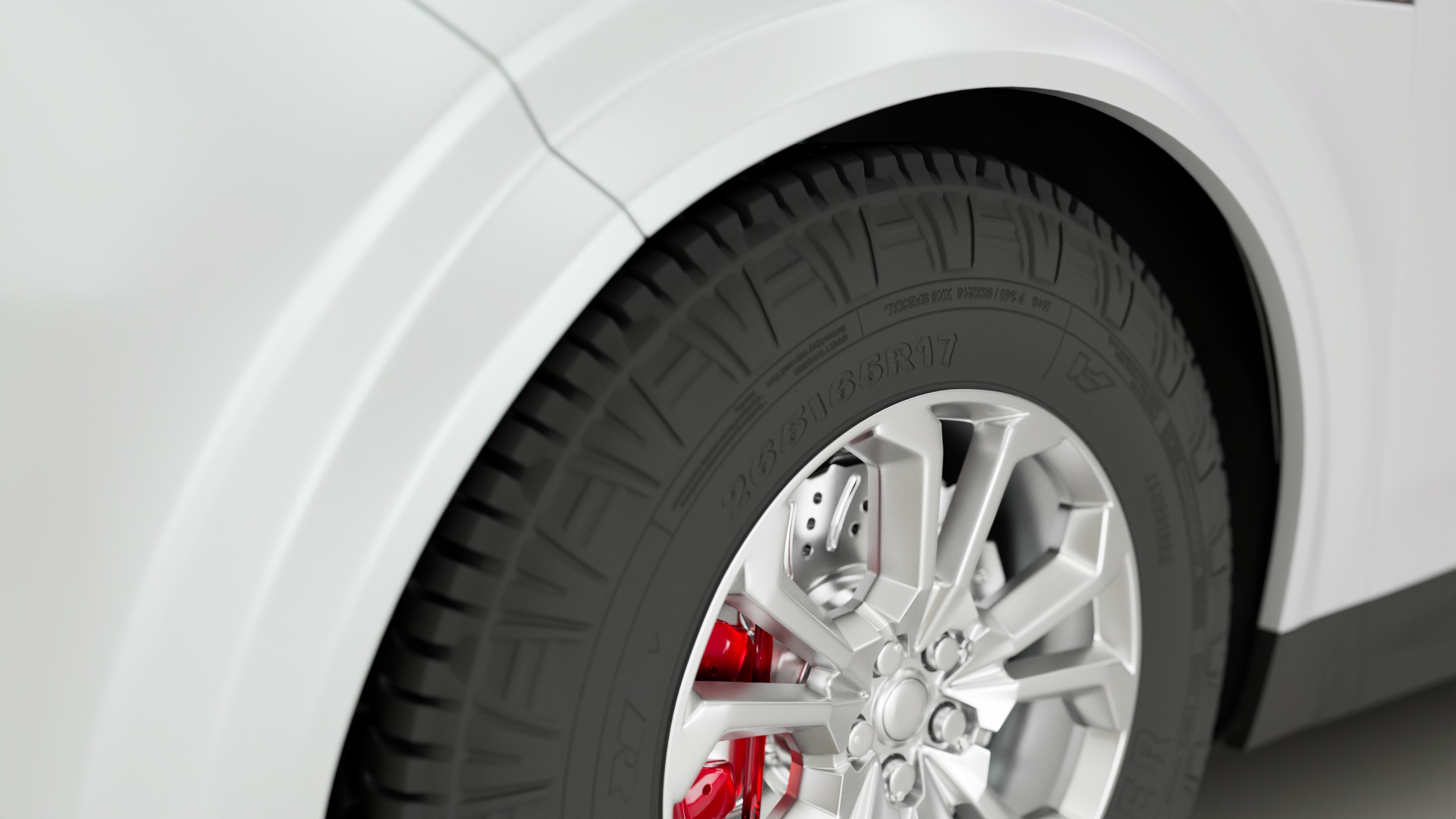 Close-up of an automotive tire illuminated for machine vision inspection, highlighting tread details and surface features for quality control and defect detection.